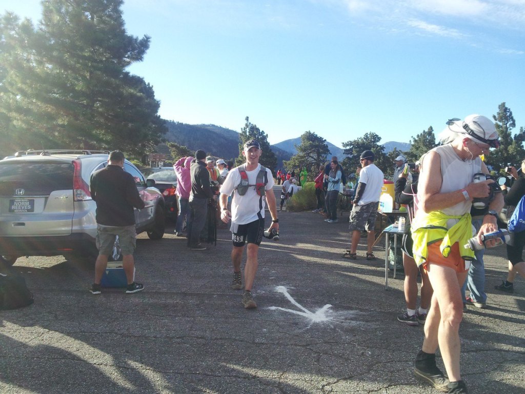 My arrival at Inspiration Point (mile 9.3), when I still had a smile on my face, during the 2013 AC 100. Photo by Emily Molstad.